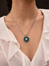 Silver Emerald Crest Medallion Necklace