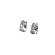 Pair of silver stud earrings on a white background